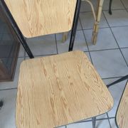 Pair of Formica chairs with a wood effect