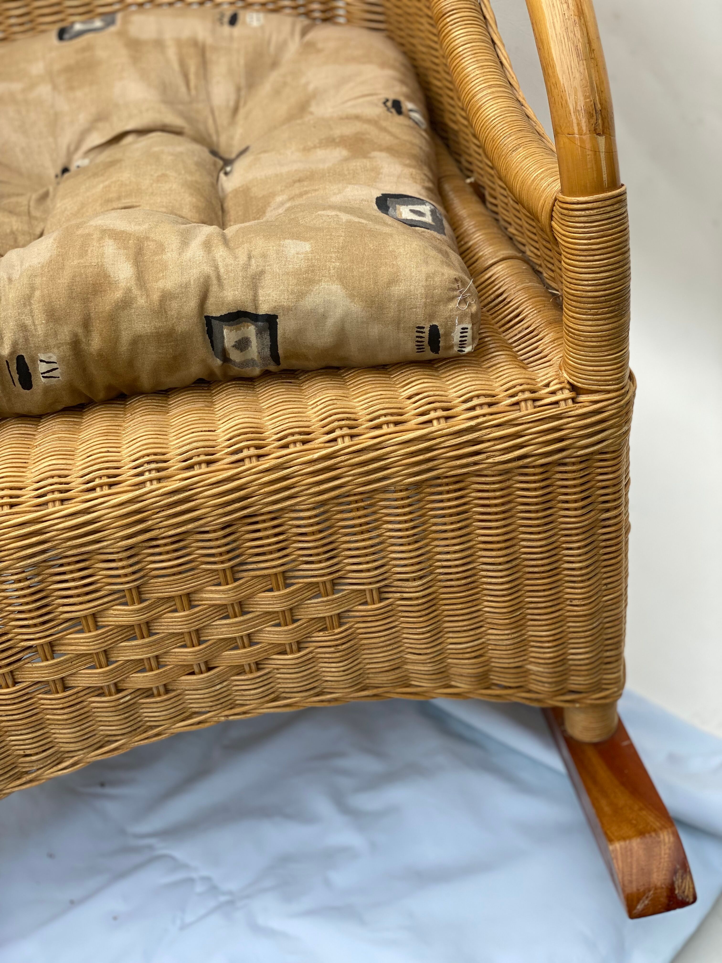 Vintage rotan and teak rocking chair