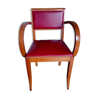 Wooden bridge chair and red skai