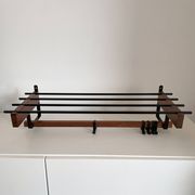 Vintage Scandinavian wall coat rack in wood and metal.