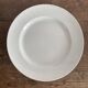 Set of large round white earthenware dishes from Creil and Montereau, 19th century