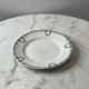 Set of 2 Saint Amand plates with laurel crown decoration.