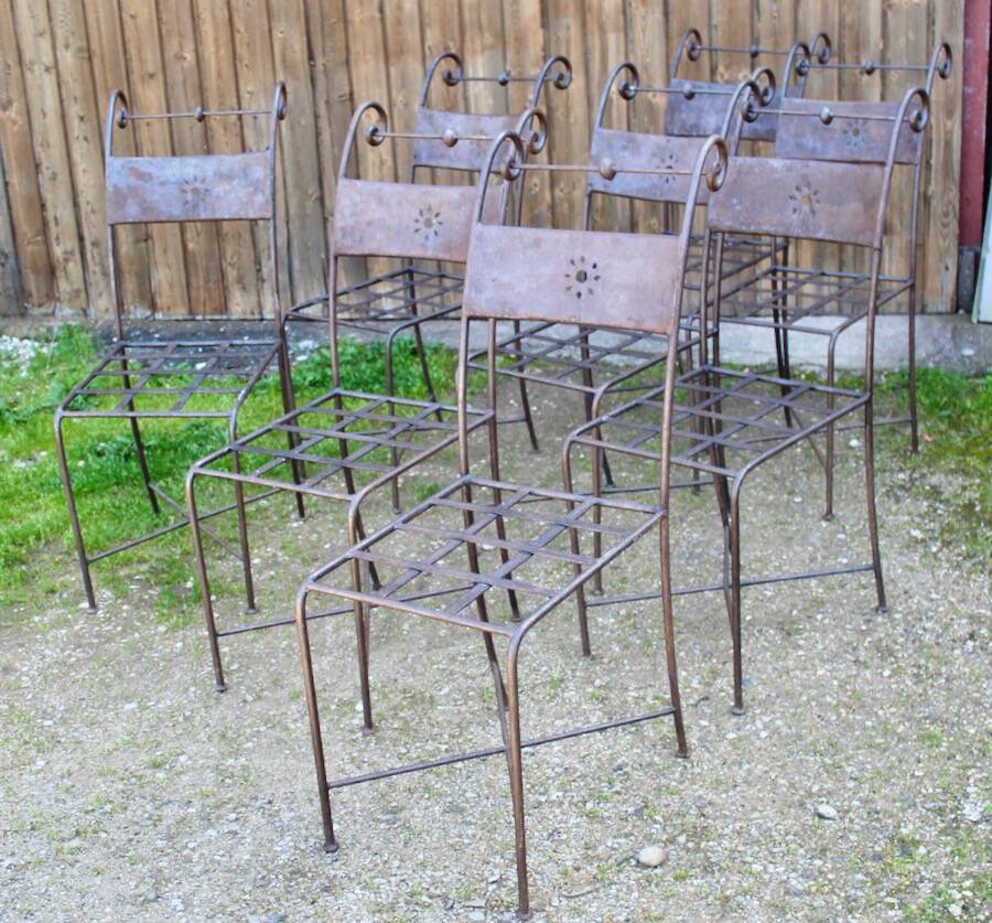 Series of 8 wrought iron garden chairs