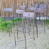 Series of 8 wrought iron garden chairs