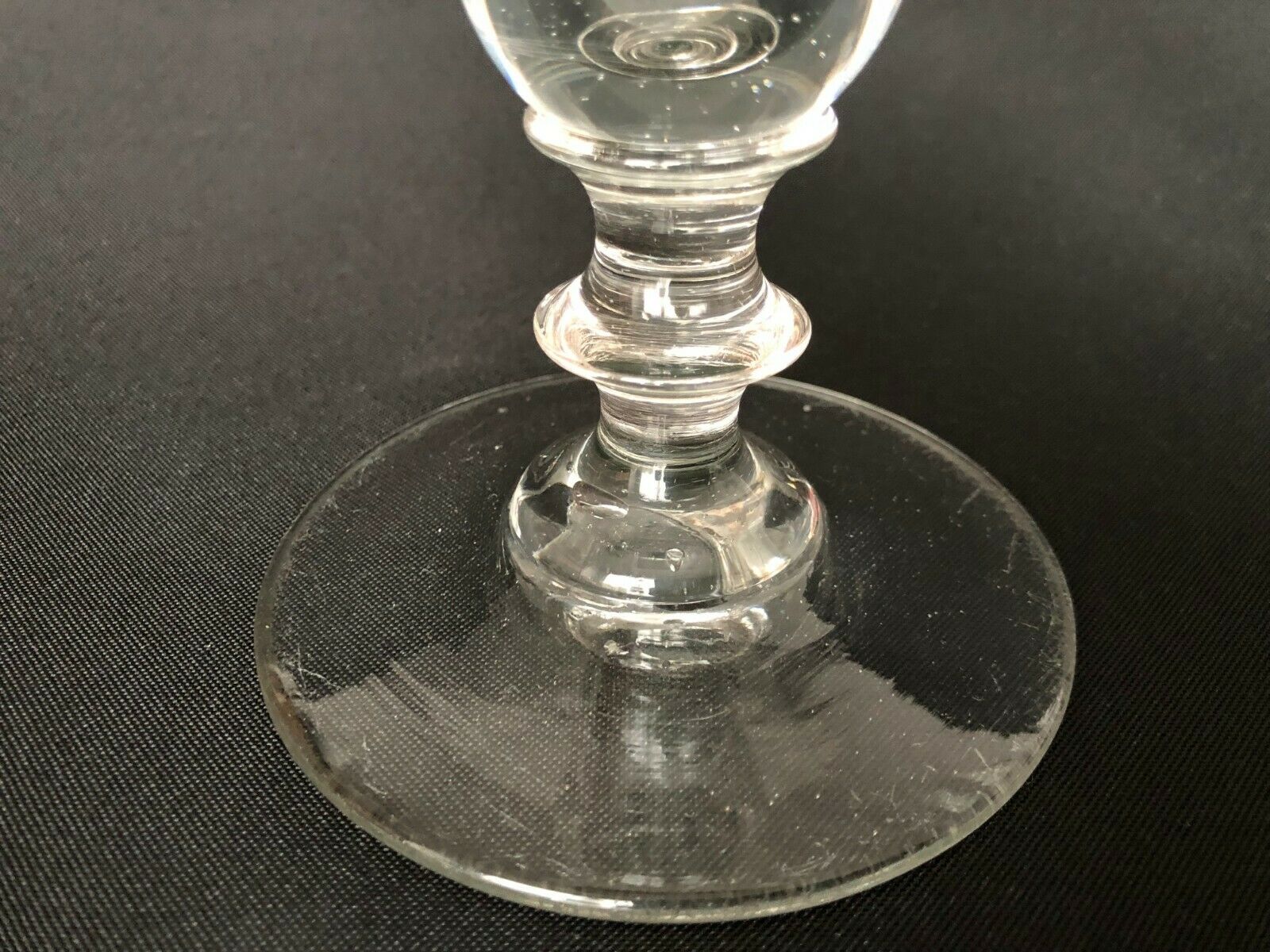 Glass oil lamp blows on foot shower