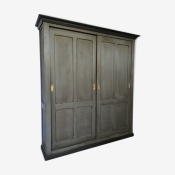 Old wooden cupboard massive sliding doors