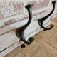 Solid teak coat hook with 4 double cast iron hooks