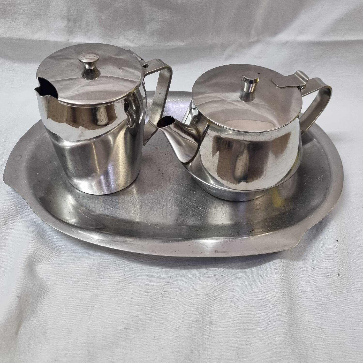 Stainless steel teapot and coffee pot from a boat, 1960