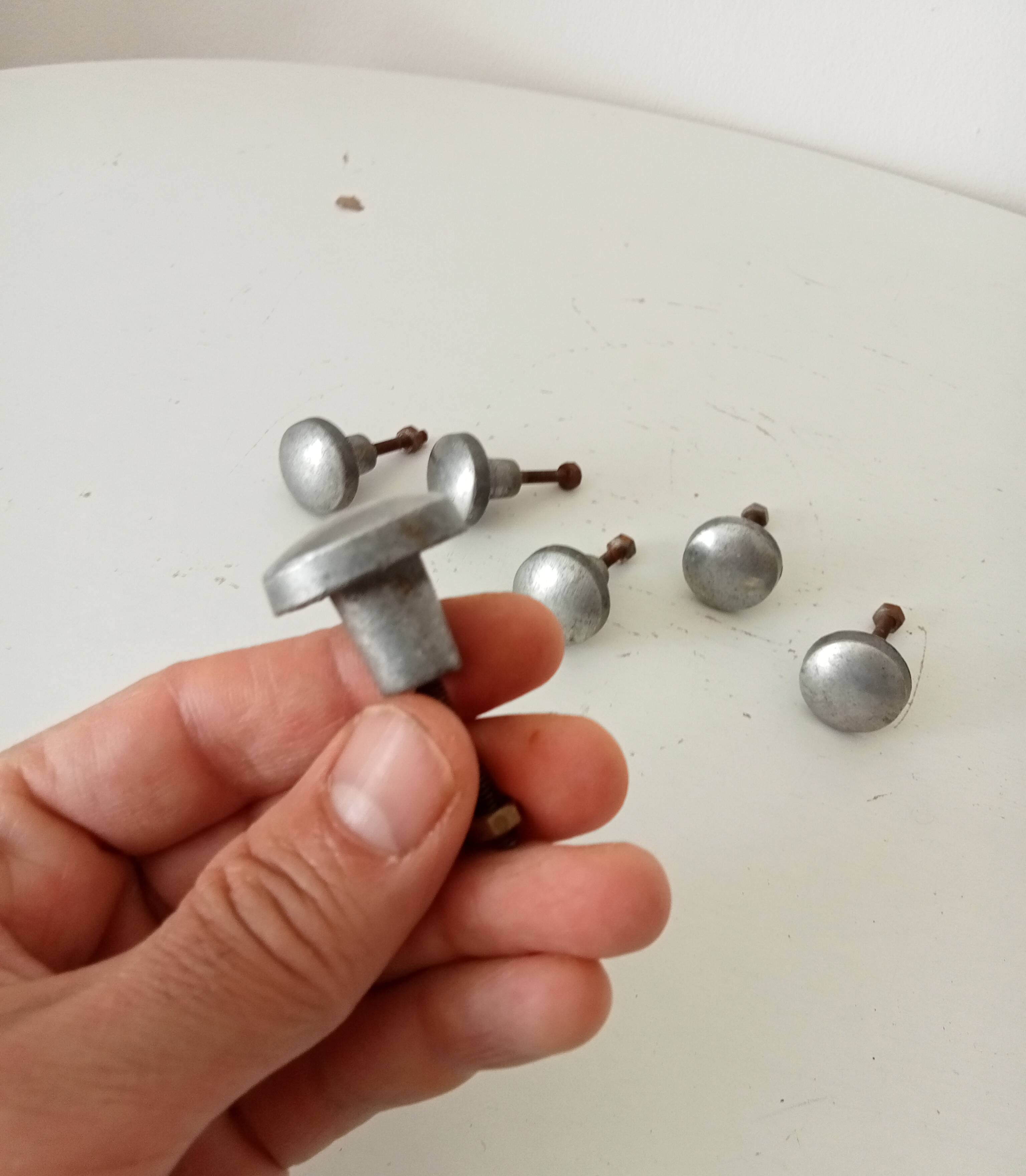 Pair of antique solid aluminium furniture handles.