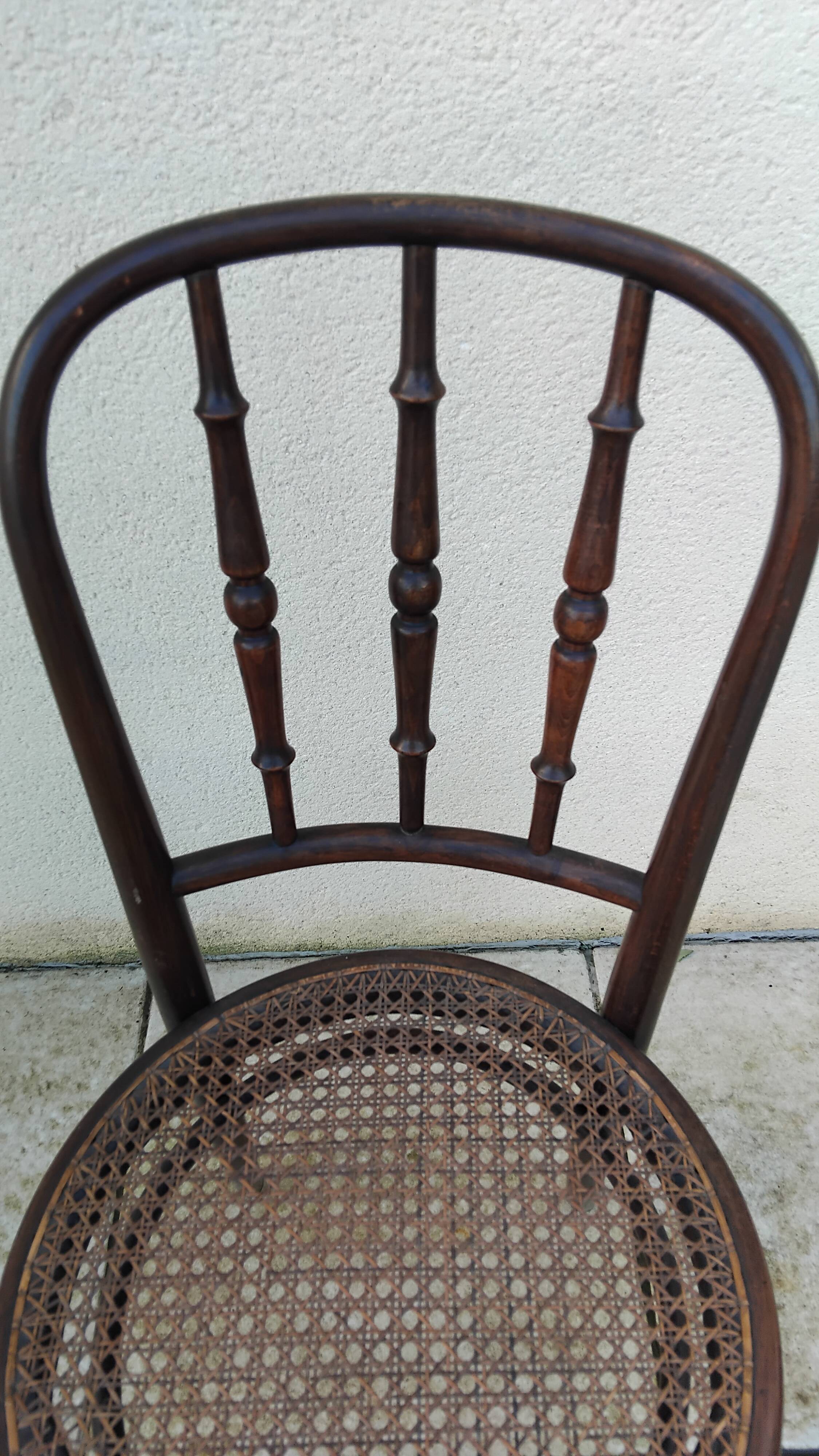 Old caned bistro chair fischel