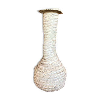 Vase made of palm leaves