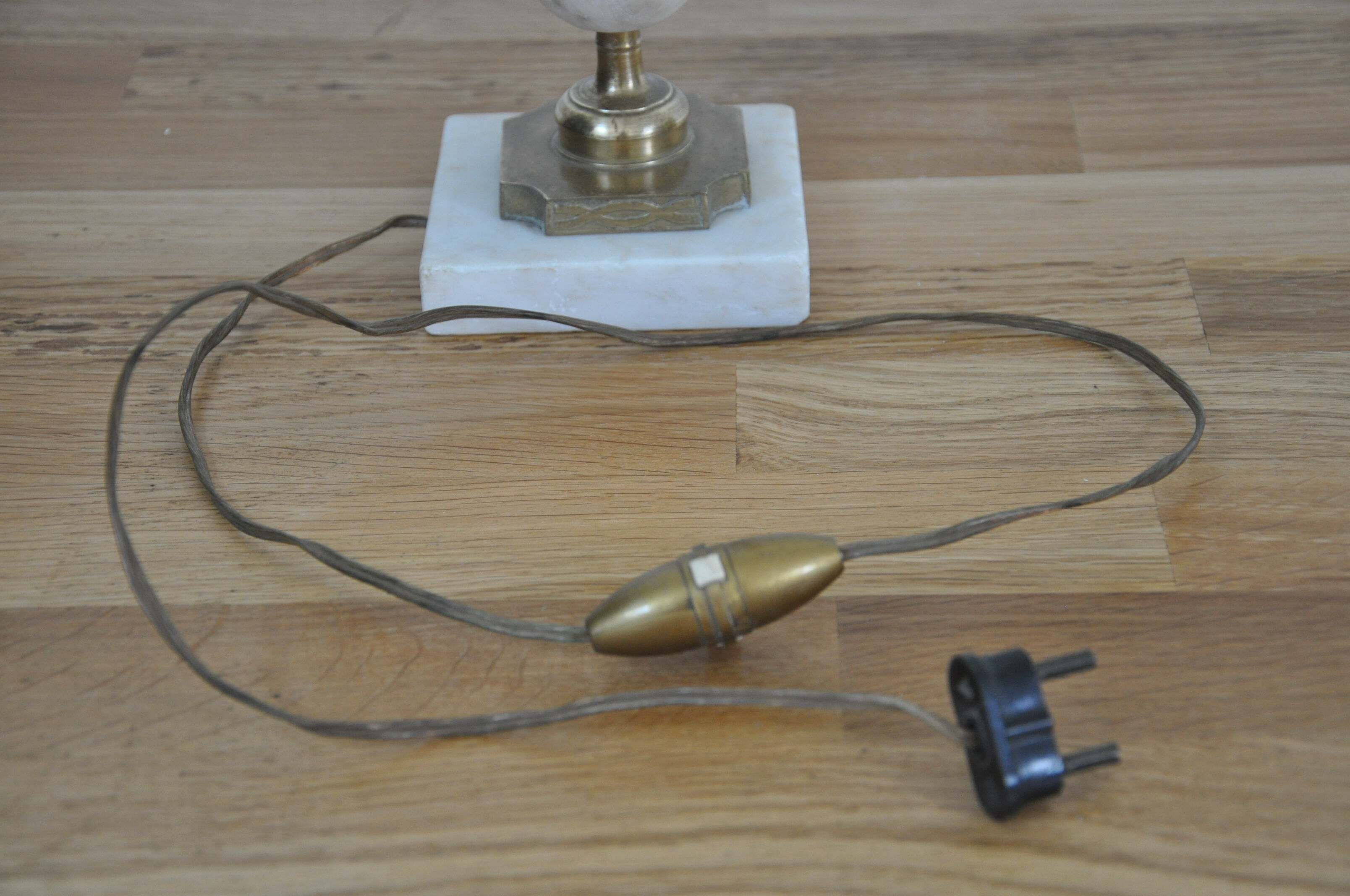 Ancient alabaster lamp and bronze cherub decoration