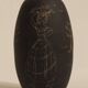 Ceramic vase decorated with women and a tree.