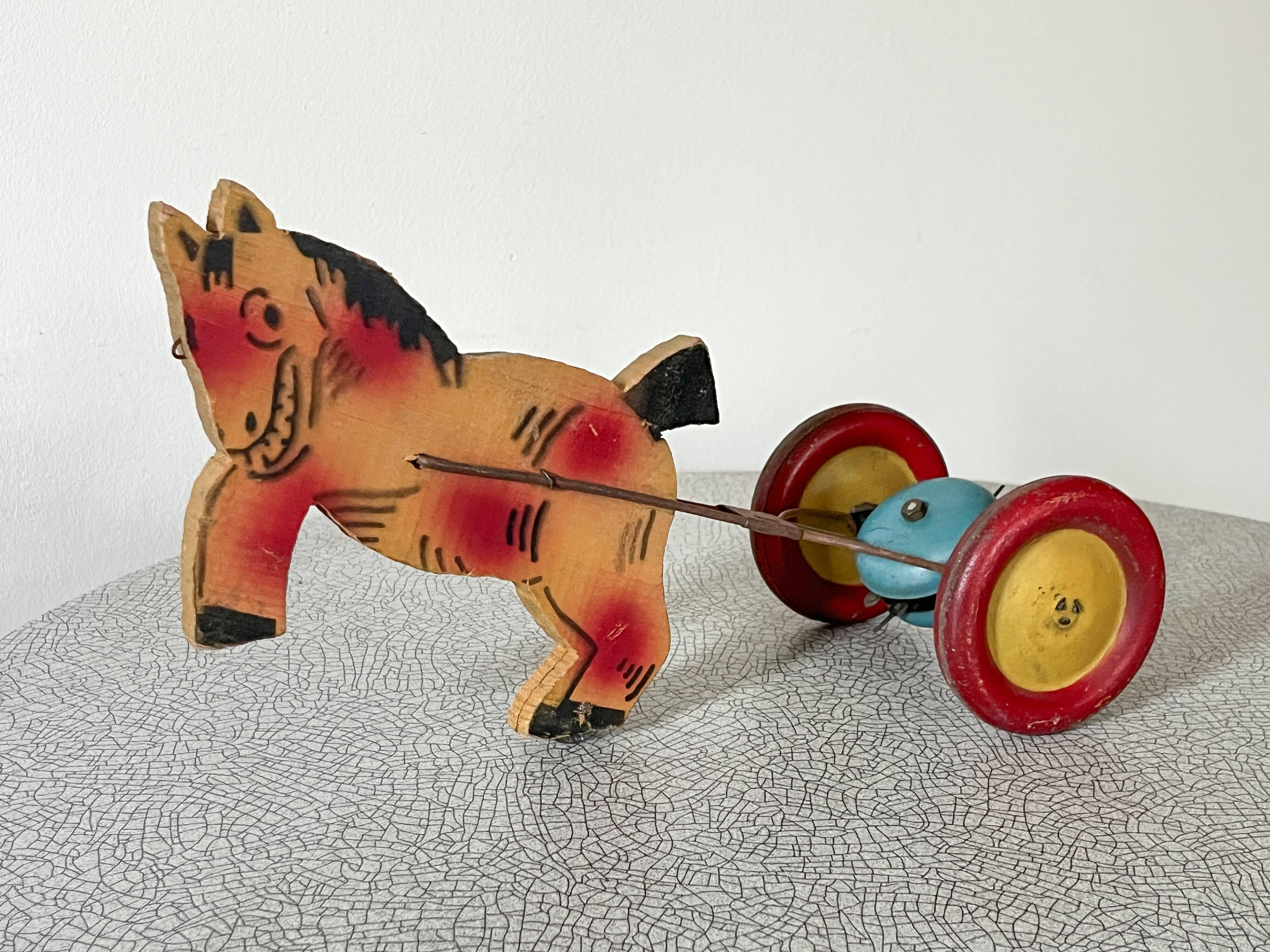 Vintage pull-along toy, horse-drawn with a bell, musical toy.