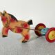 Vintage pull-along toy, horse-drawn with a bell, musical toy.