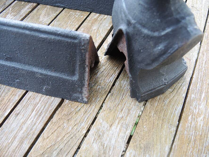 Antique cast iron fireplace andirons: bust of a garçonne