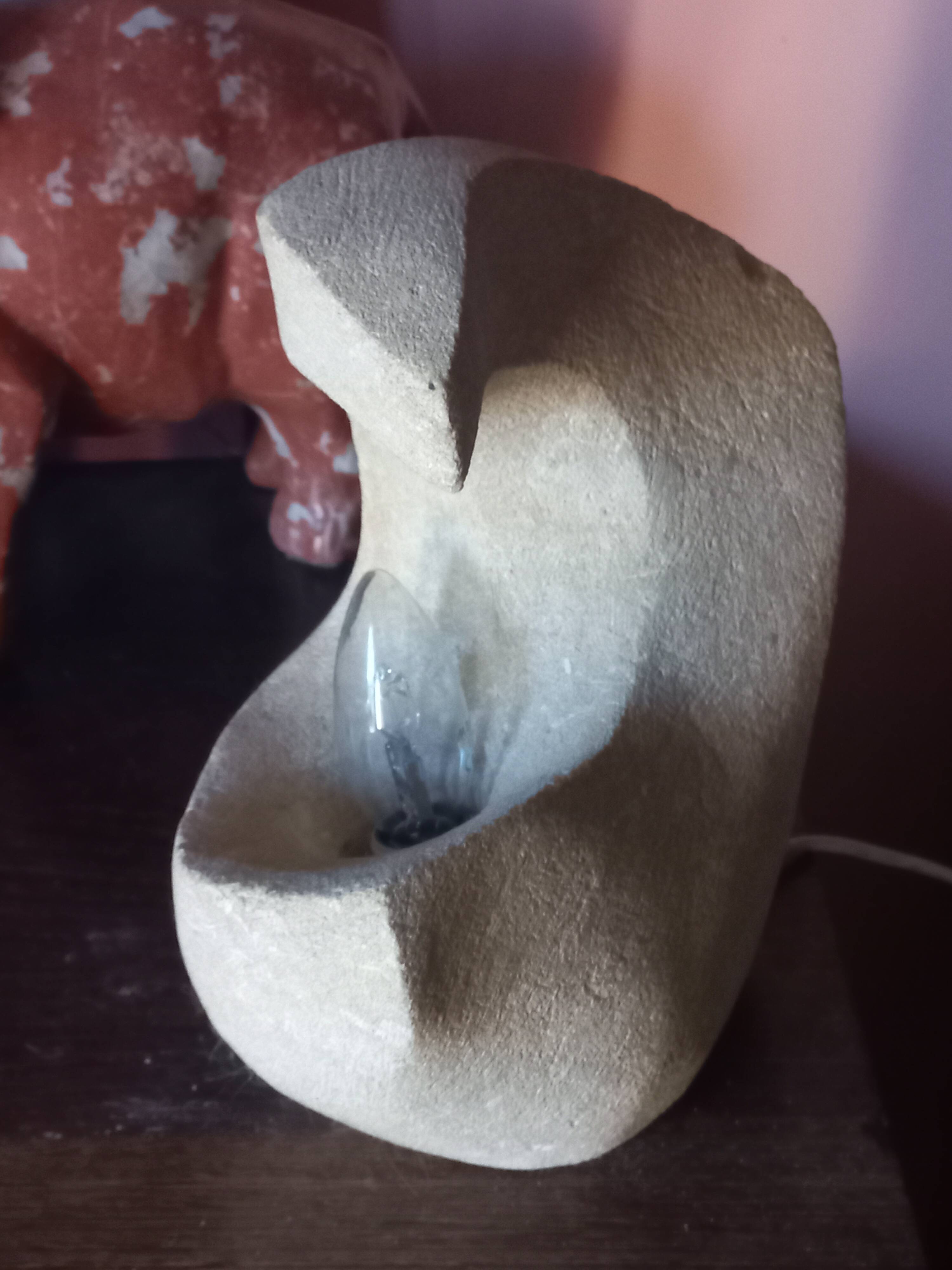 Sculpted stone lamp from the 1970s, signed.
