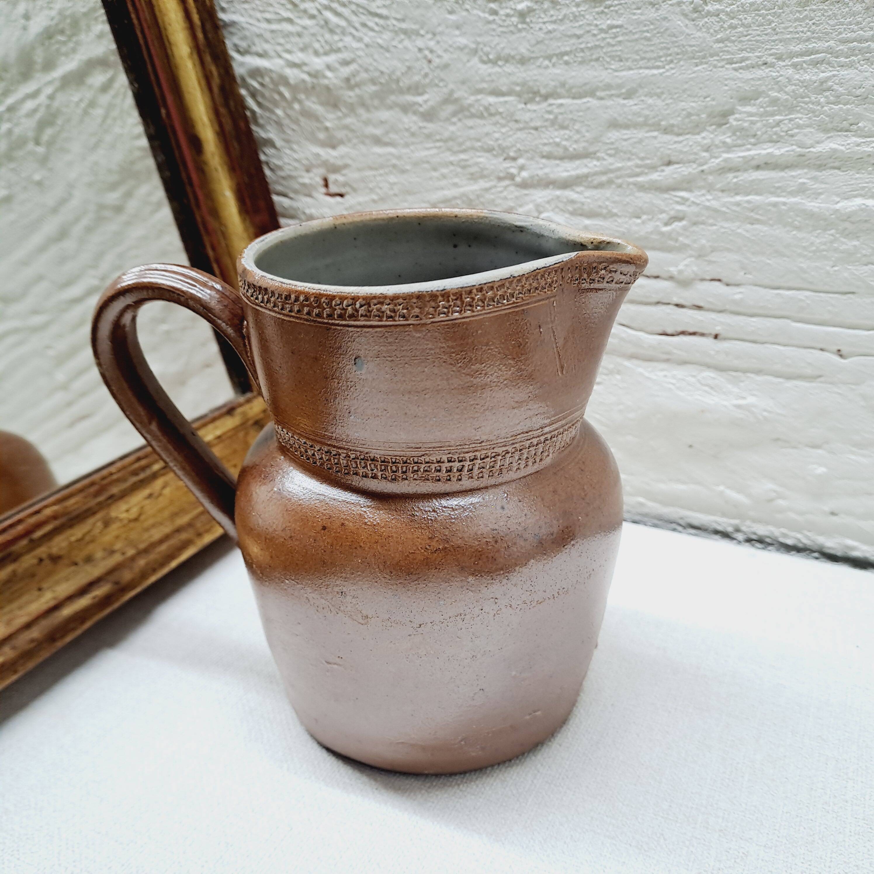Antique stoneware milk jug