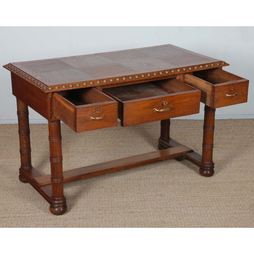 Oak and brass desk in the style of Charles Dudouyt, 1940.