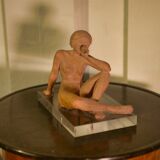 Terracotta sculpture of a seated woman by Norbert Treca contemporary art.