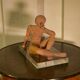Terracotta sculpture of a seated woman by Norbert Treca contemporary art.