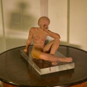Terracotta sculpture of a seated woman by Norbert Treca contemporary art.