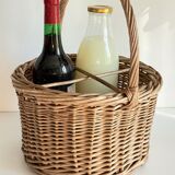 Basket with vintage rattan bottles