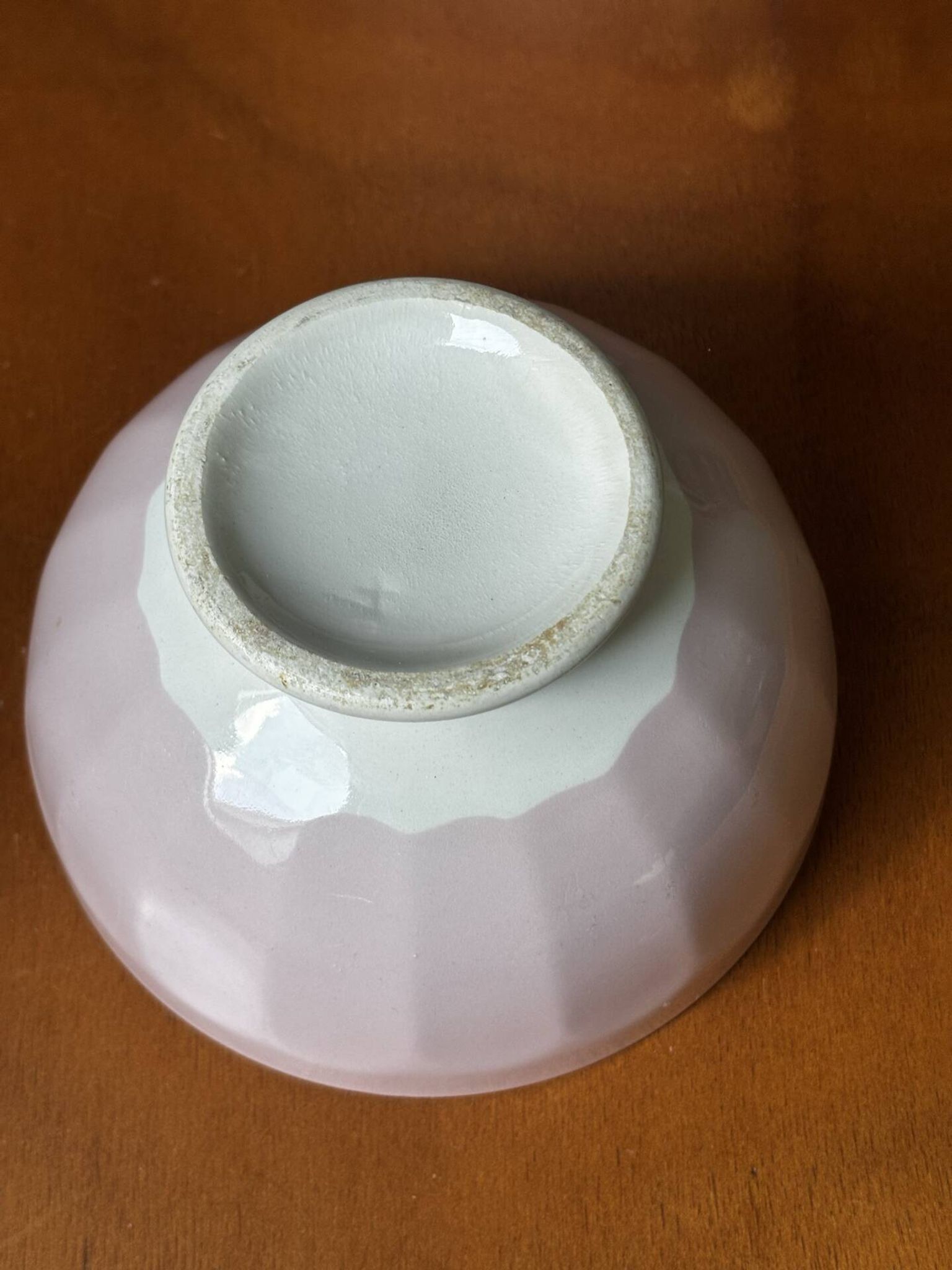 Old faceted bowl in pink earthenware