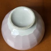 Old faceted bowl in pink earthenware