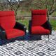 Vintage armchairs in red and black faux leather, the pair.