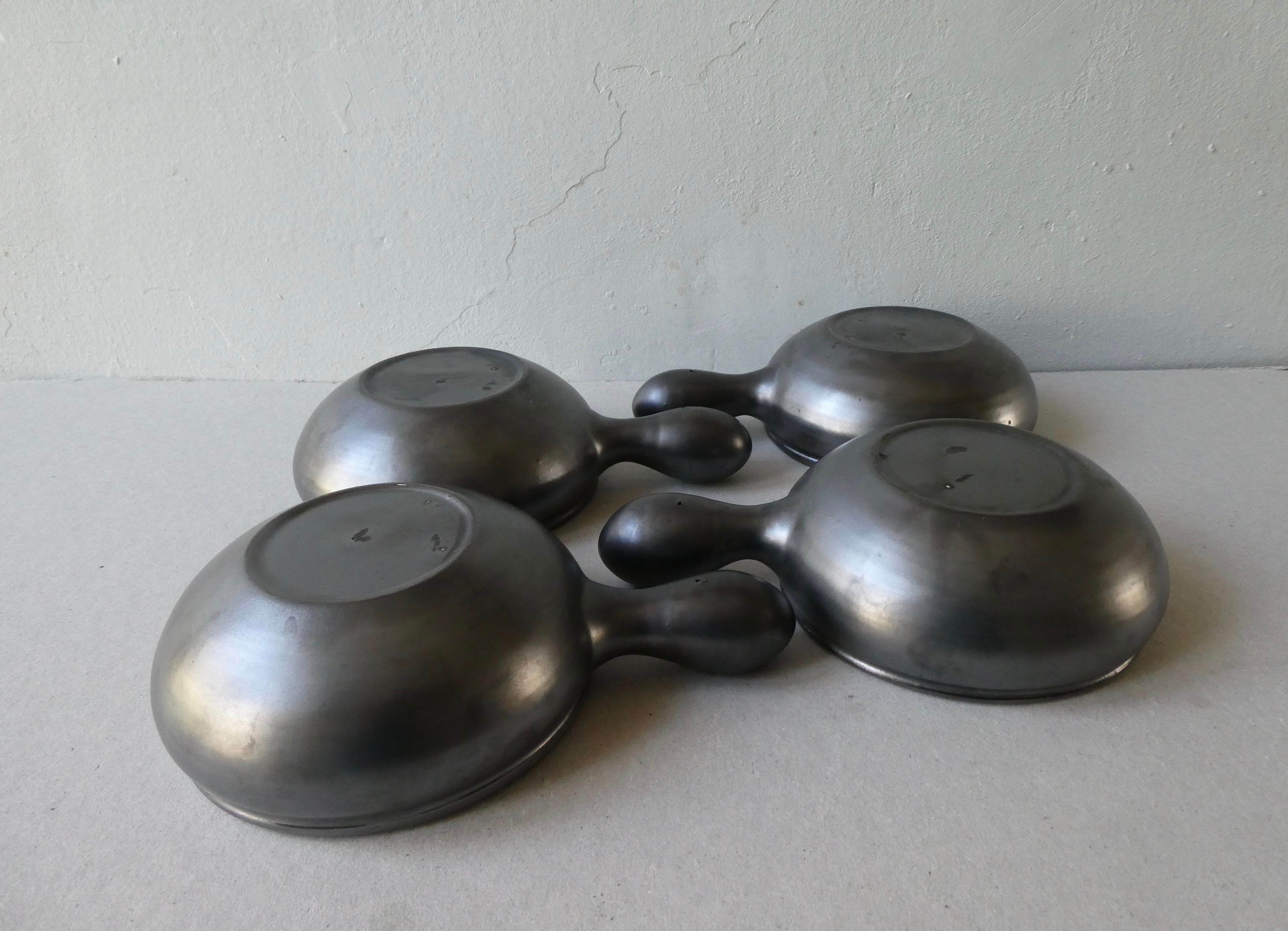 Lot of 4 black and colored ceramic cups