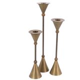 Trio of brass candlesticks by Christian de Beaumont