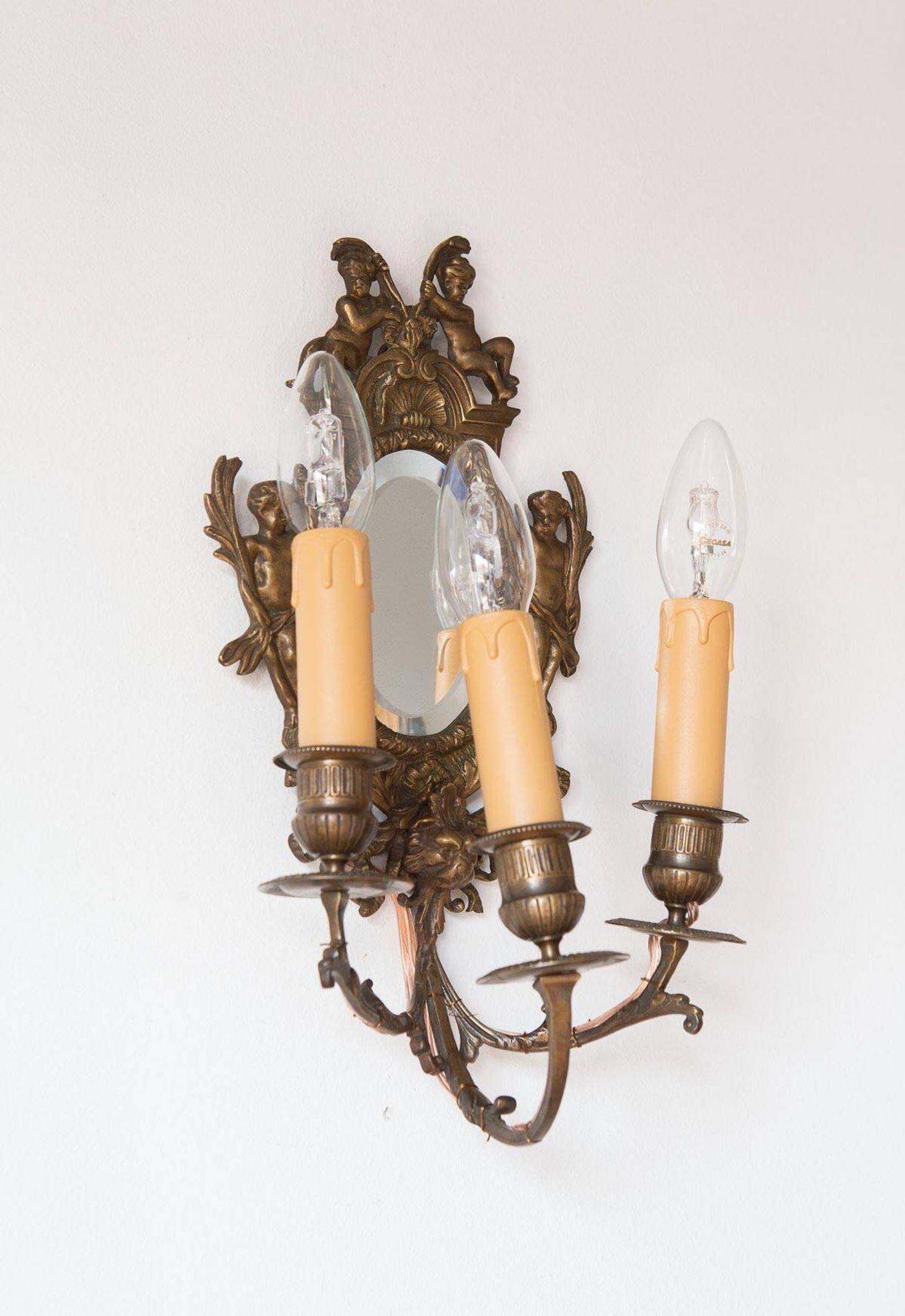 Pair of old French wall lights with beveled mirror and putti