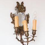 Pair of old French wall lights with beveled mirror and putti