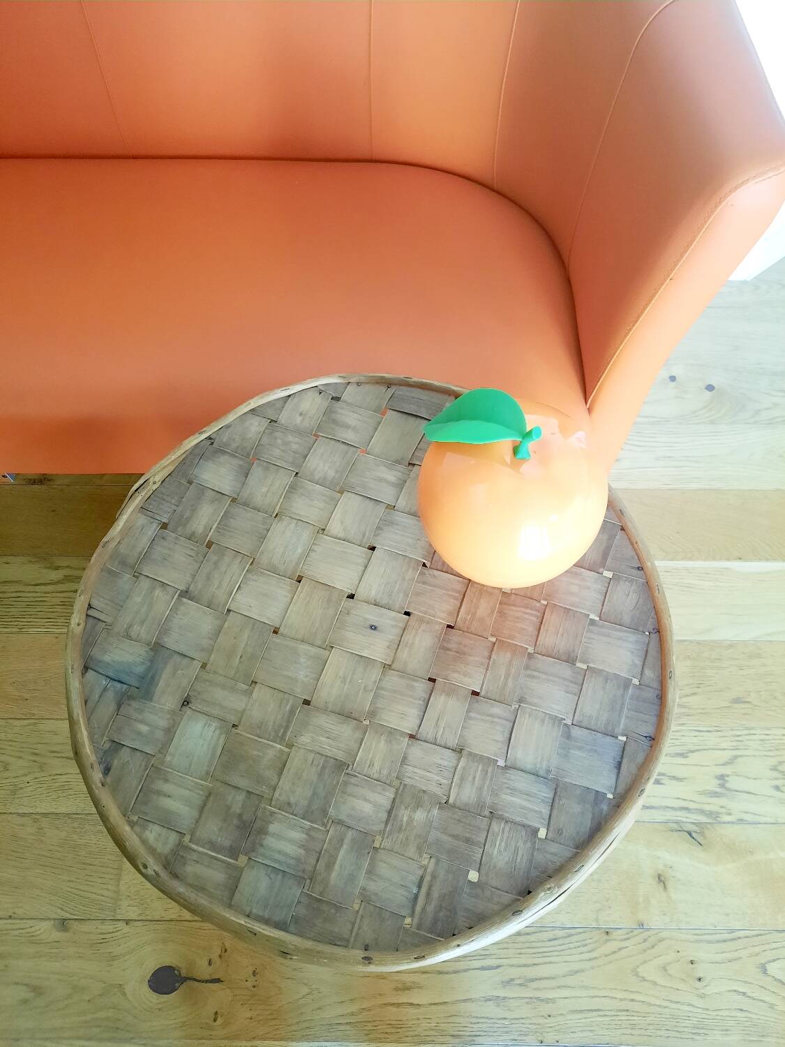 Old bamboo/rattan table with woven palm leaves.