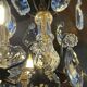 Three-light chandelier in bronze and cut crystal, early 20th century work.