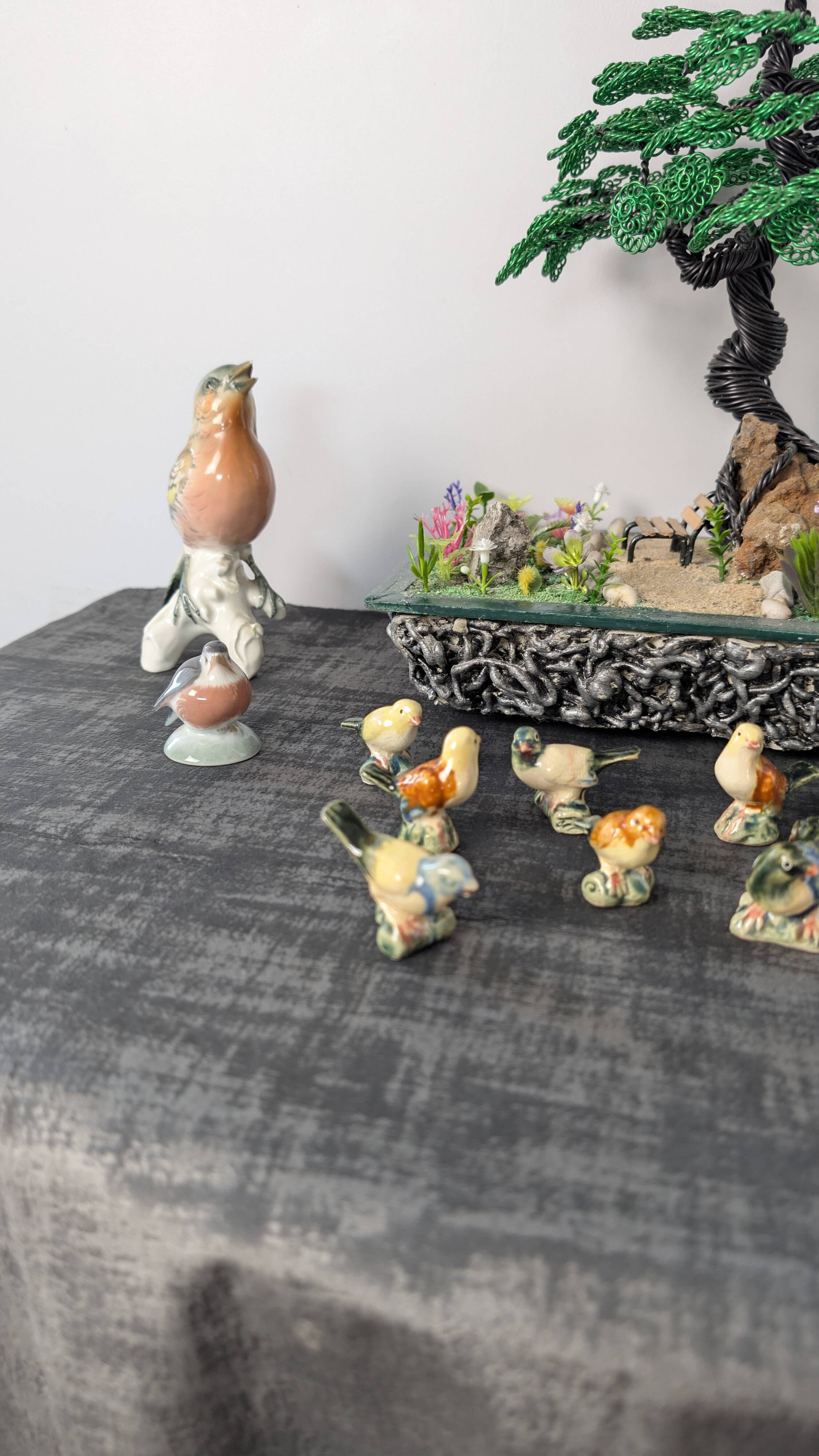 Set of 11 miniature birds in polychrome glazed ceramic.