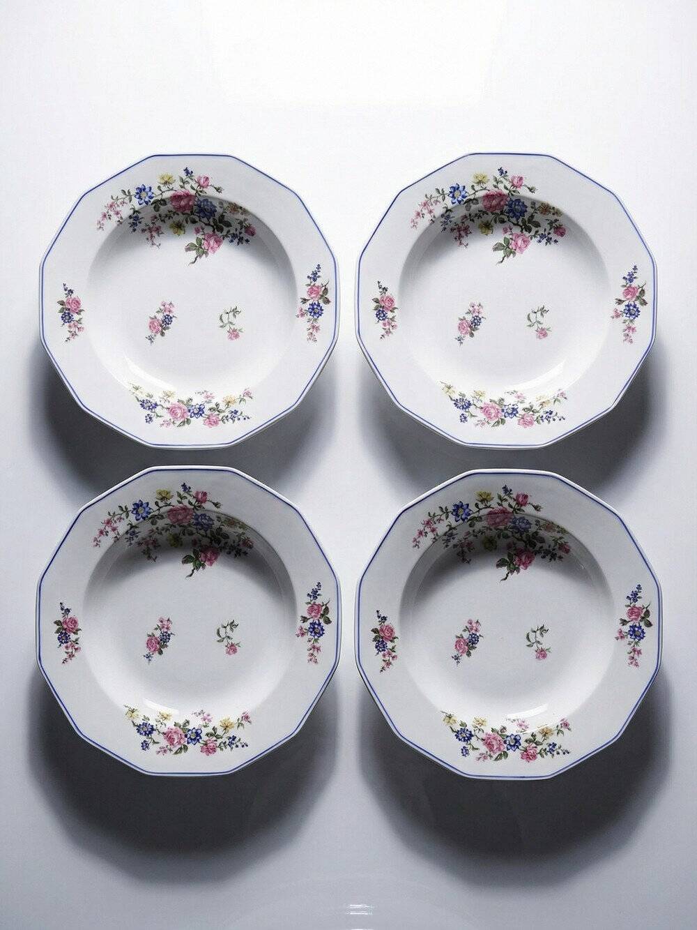 4 deep plates Bernardaud Limoges porcelain with floral decoration from the 1920s to 1950s.