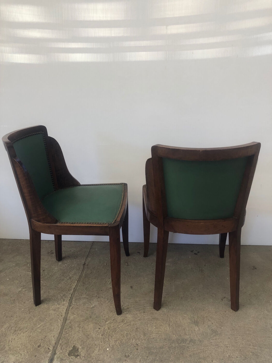 Pair of old wood and green leather gondola chairs