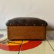 Old foldable fisherman's stool in wood and leather