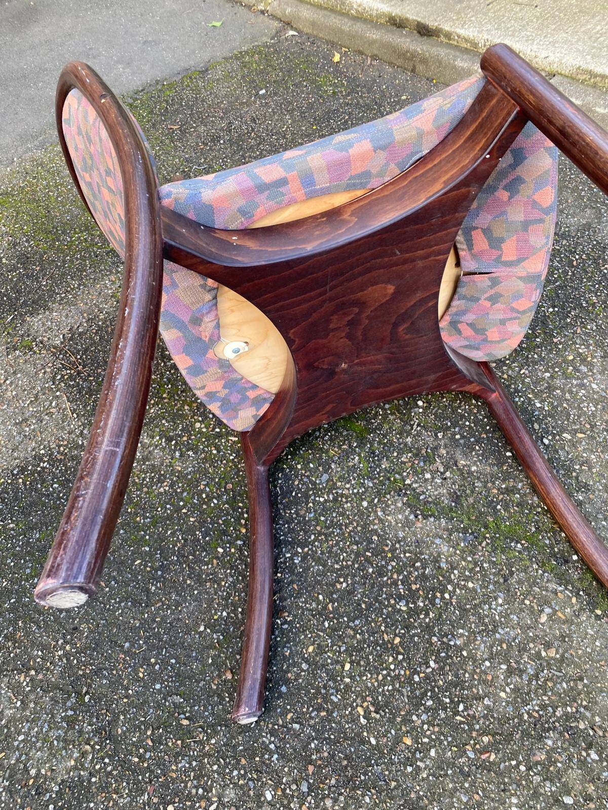Scandinavian chair in curved solid teak wood and fabric.