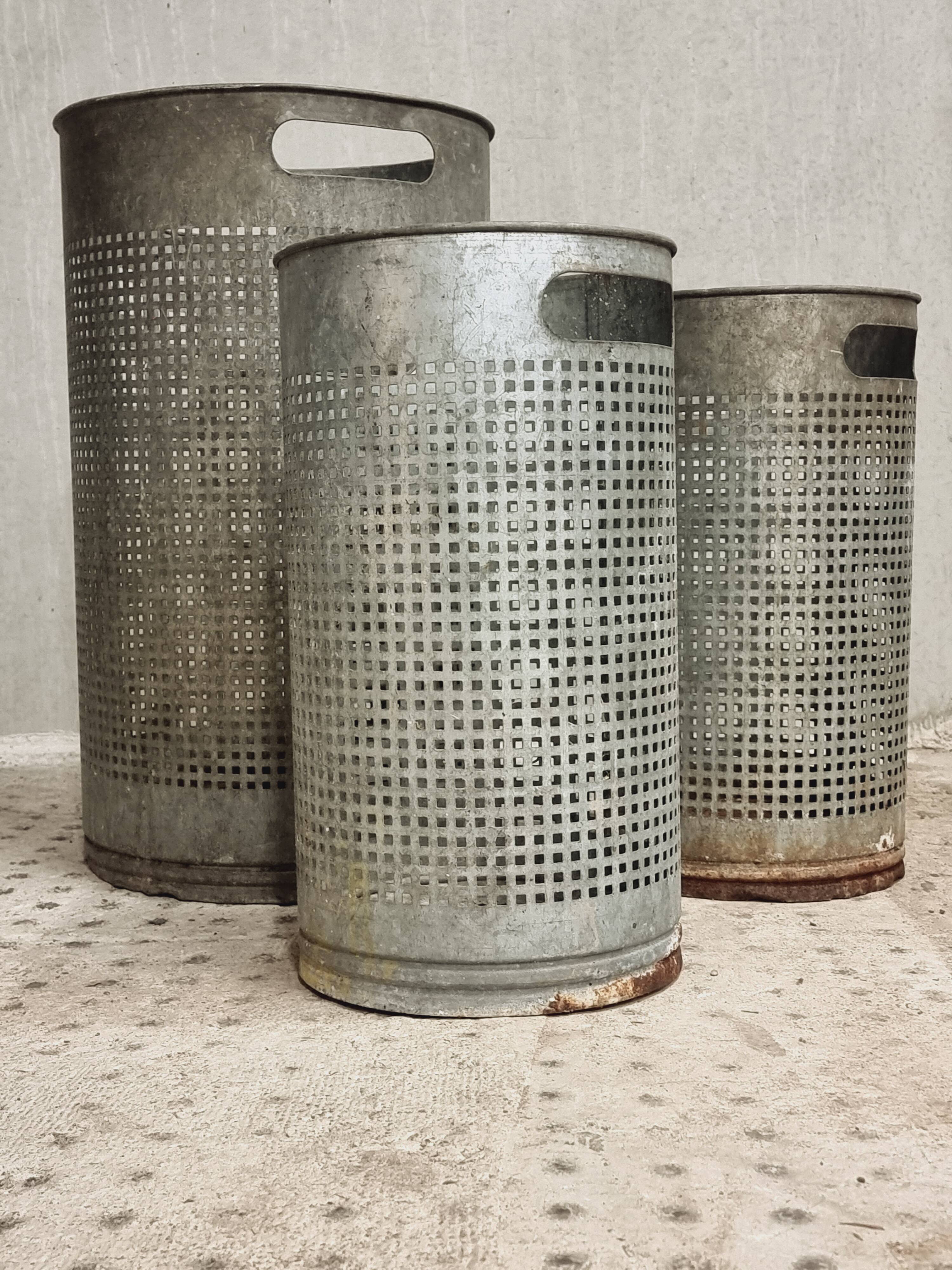 Vintage set of perforated metal waste bins