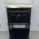 Romantic black bedside table with patinated marble and wood