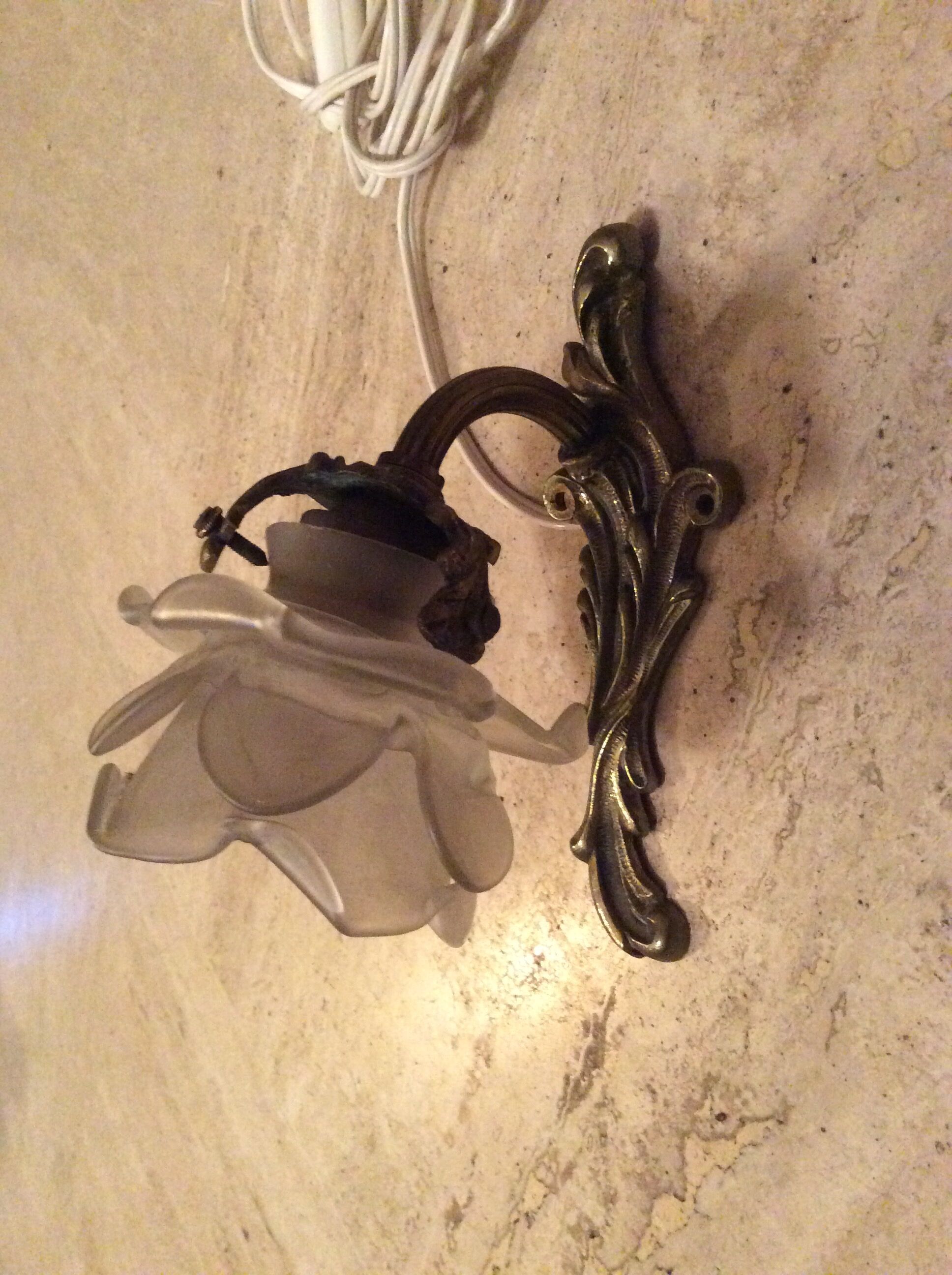 Old wall lamp in bronze and glass