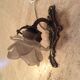 Old wall lamp in bronze and glass