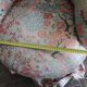 pair of toad armchairs in floral fabric.