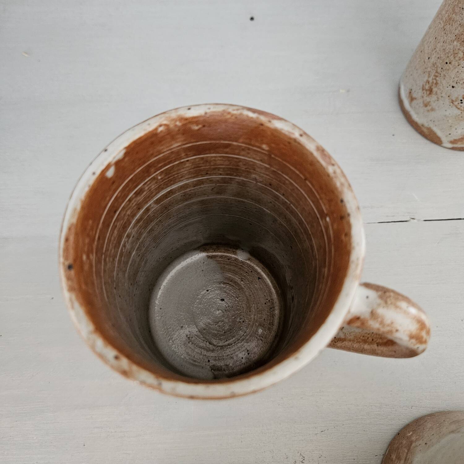 Set of 5 vintage handcrafted stoneware mugs in beige, pink, and white glazed stoneware