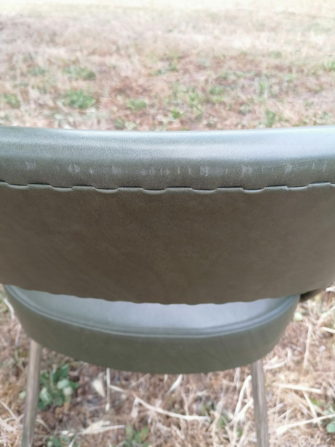 Vintage conference armchair in green skai Roset SNA