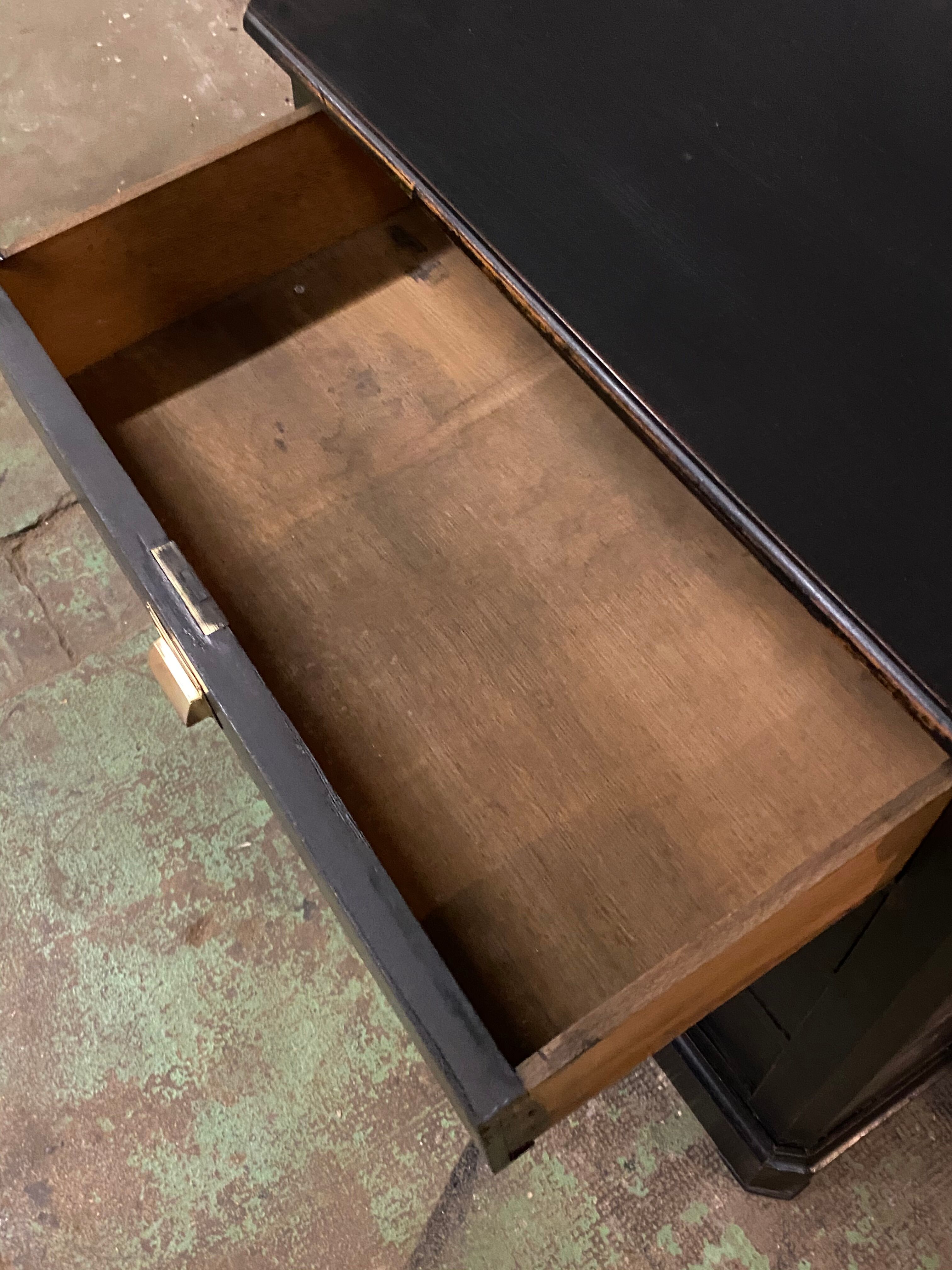 Old black patinated chest of drwers