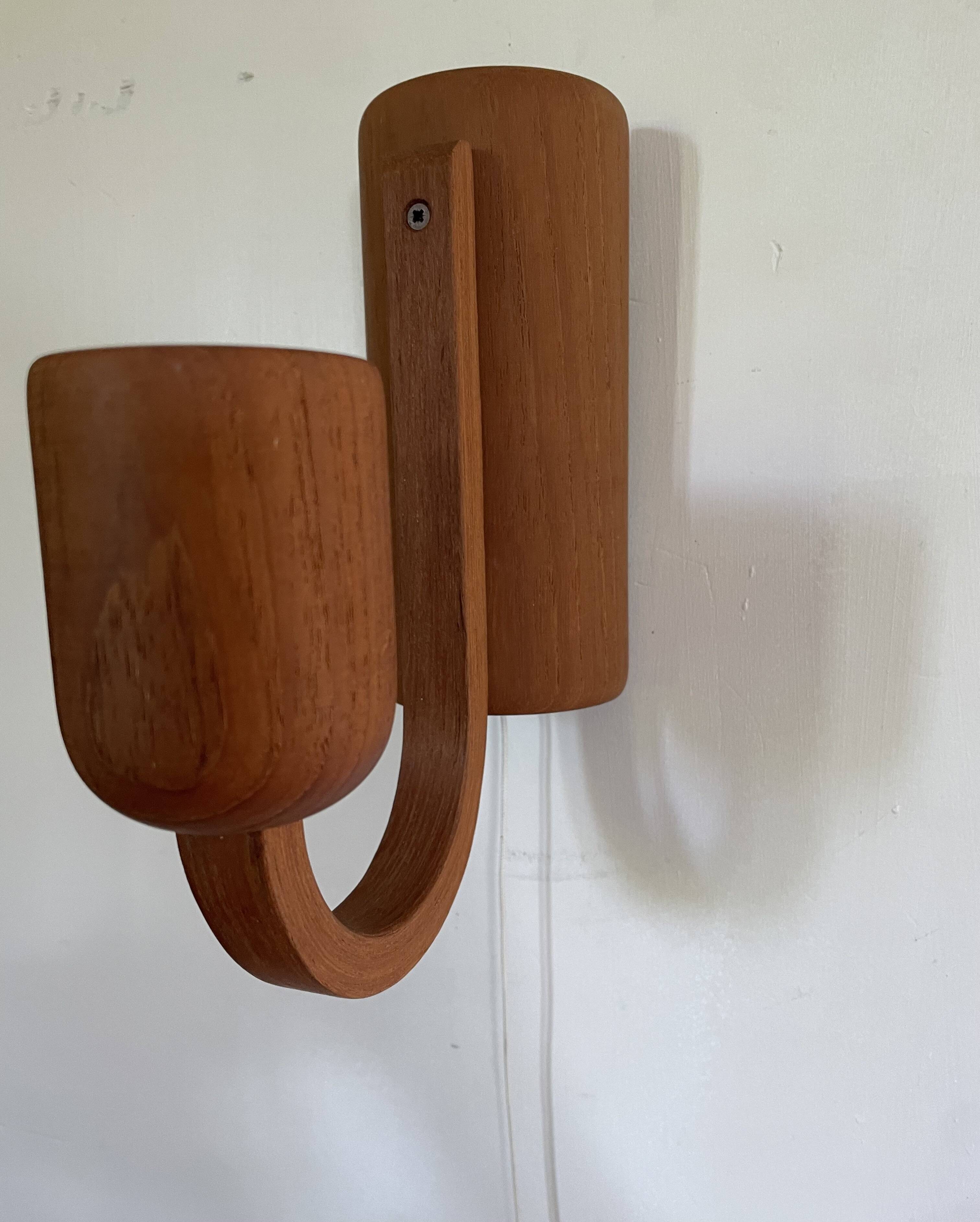 Pair of Scandinavian teak wall lights, Dolmus, 70s